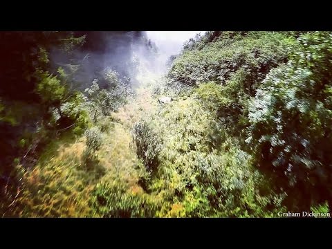 Wingsuiting In A River Bed Of Clouds - Graham Dickinson