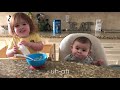 Big Sister feeds baby brother