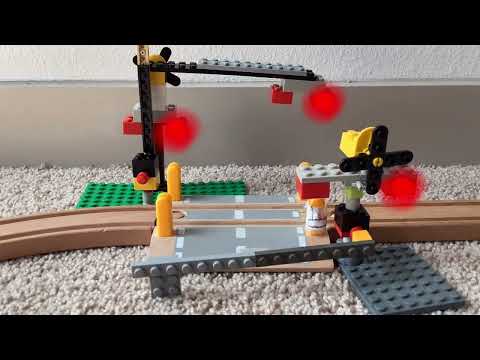 Railroad Crossing With LEGOS And the wooden trains