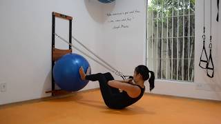 Variação do Rolldown na Prancha de Molas com a Fitball