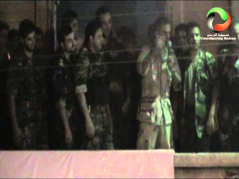 مشاركة أفراد من كتيبة خالد بن الوليد في مظاهرة في مدينة الرستن