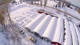 preview picture of video 'Aerial drone footage of Swan River Gardens greenhouses after three plus feet of snowfall'