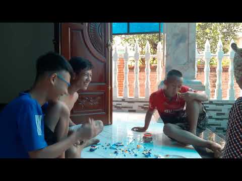 Huy sat and assembled pictures with Uncle Quang