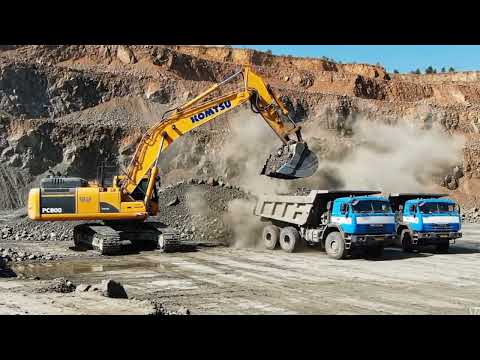 Caterpillar 385C Excavator Loading Trucks And Caterpillar Dumpers