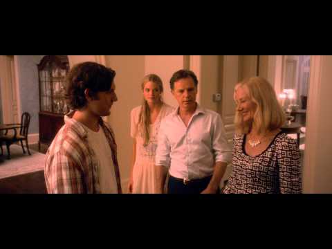 Trailer frame: graduation party lights and warm palette that match the soundtrack’s pop/indie sheen