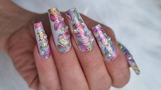Rainbow nails with gold foil filigree and crystal placement. Simple nail design for beginners 