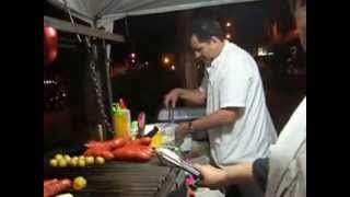 preview picture of video 'San Javier, Medellin Colombia Street vendor couple of sausage dogs, potatoes #1'