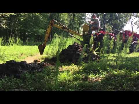 Rural King Rk37 with backhoe attachment