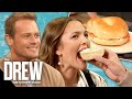 Sam Heughan Feeds Drew as She Helps Him Find the Best Bagel in NYC