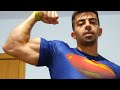 Flexing Biceps in Tight T-Shirt