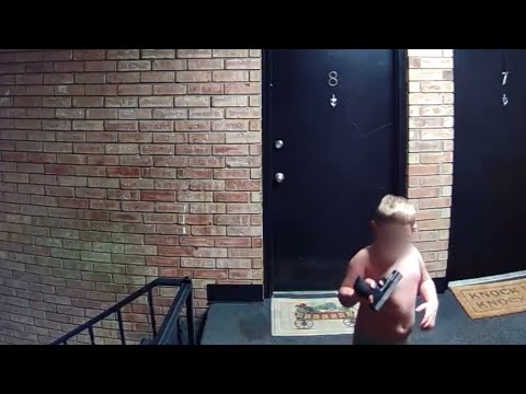 Surveillance Video Shows Young Child Holding a Gun