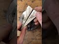 Man makes a paper airplane out of a thin sheet of silver that he melted down!