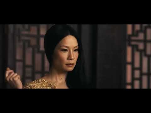 Trailer frame: Jungle Village street mêlée; percussive score driving a flurry of blades