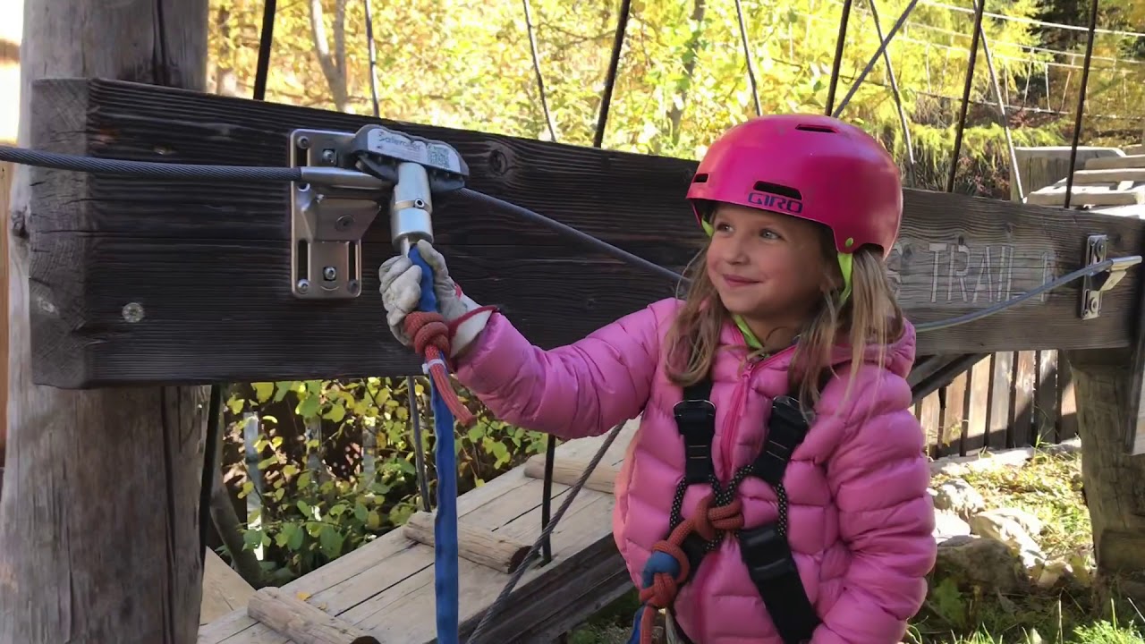 Navigate through the treetop course with stunning mountain views, making every climb and jump an unforgettable moment.