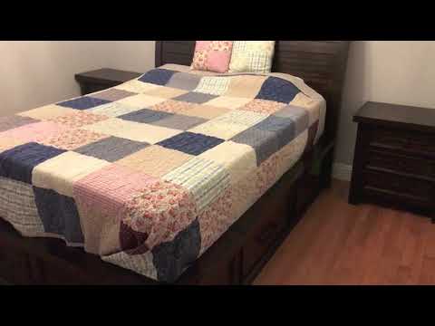 Part of a video titled Assembling Queen bed frame with storage drawers - WE LOVE IT!