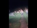 Police patrolling graveyard cemetery at night