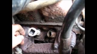 1994 Dodge Ram, how do you get spark plugs out?