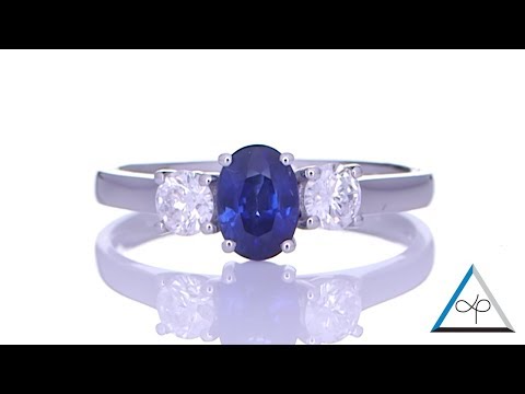 Blue Sapphire With Two Diamonds Placed On A Silver Ring | Prakash Gems