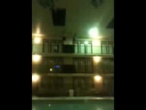 3rd story hotel balcony jump into 5ft pool