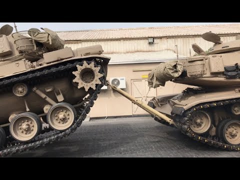An M60 tank fails to break a U.S. Army Battlebar