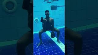 Guy With Dumbbells Performs Random Exercises Underwater-1334672