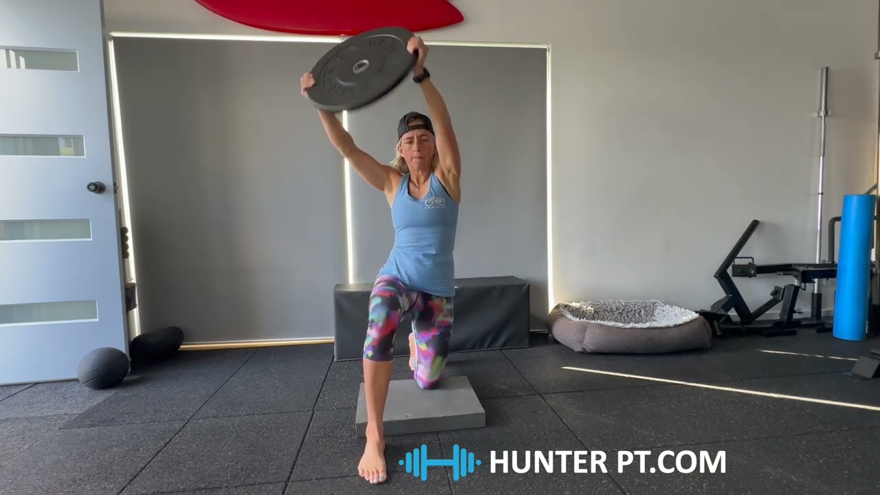 Half Kneeling Plate Swing with olympic plate