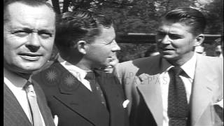 Hollywood actors George Montgomery, George  Murphy and Ronald  Reagan  pose and t...HD Stock Footage