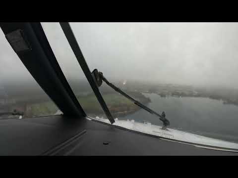 Battling the strong wind and rain while landing at Amsterdam Schiphol airport on runway 22
