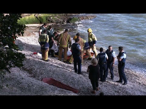 RESCUERS SAVE TWO FROM DROWNING AFTER BOAT CAPSIZE