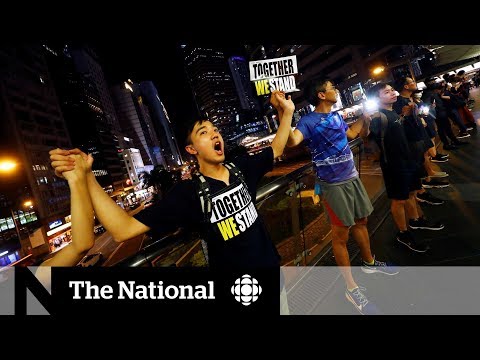 Hong Kong protesters form human chain in call for democracy