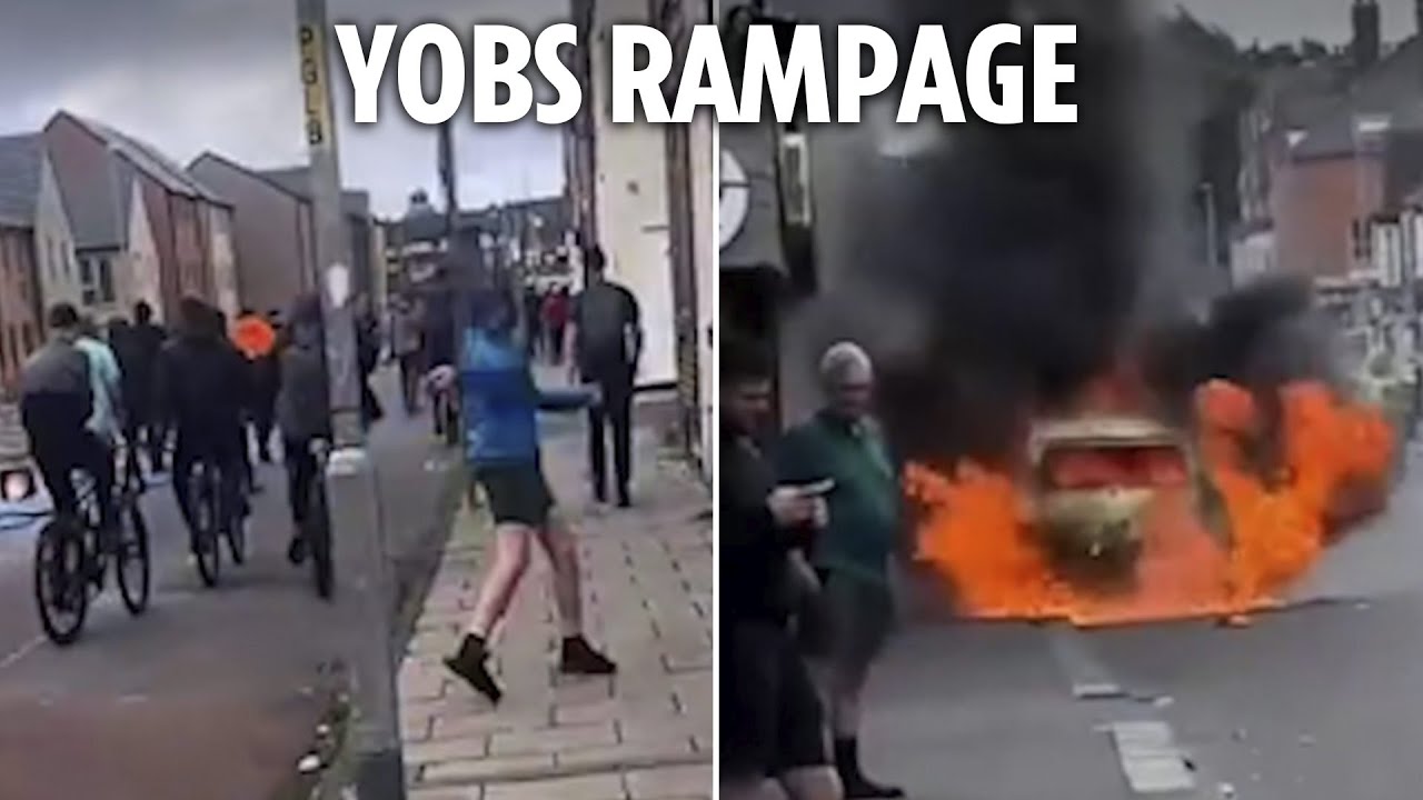 Moment thugs rampage through residential streets smashing windows & destroying cars