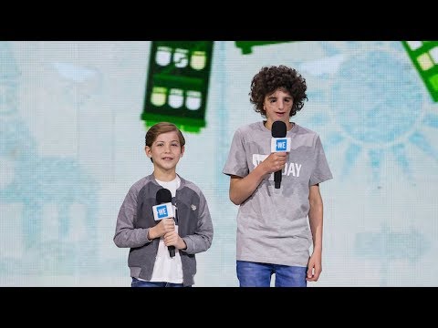 Jacob Tremblay and Nathaniel Newman speak together onstage at WE Day Seattle