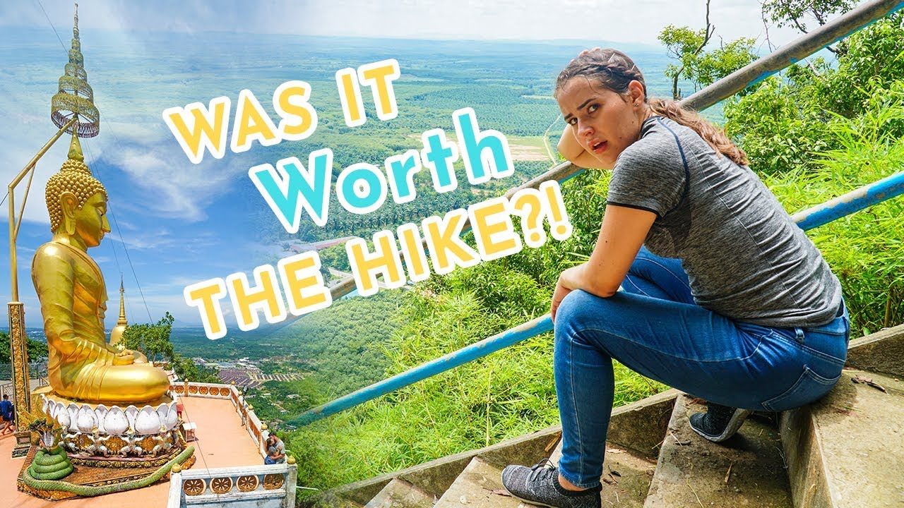 Experience the exhilarating hike to the Tiger Cave Temple with travelers.