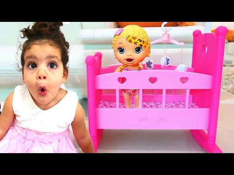 Amira pretend play with baby doll and toys