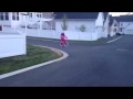 Julia Rides A Two Wheeler