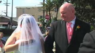 Wedding videographer Jim Costa writes: "I shot [this] in August 2008 at the Mission Beach Women's Club in San Diego. The minister was busy reading his opening comments, and her back was to everyone in attendance. I was the only one to see her. Her dad glanced over at her and then saw me doing a double-take and began to laugh out loud." [link]