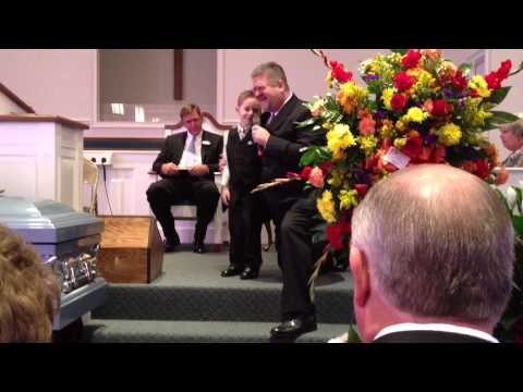 A loving son and grandson sing at Papa's funeral.