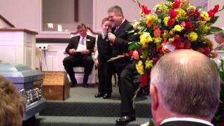 A loving son and grandson sing at Papa's funeral.