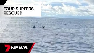 Four Australians rescued after clinging to surfboa