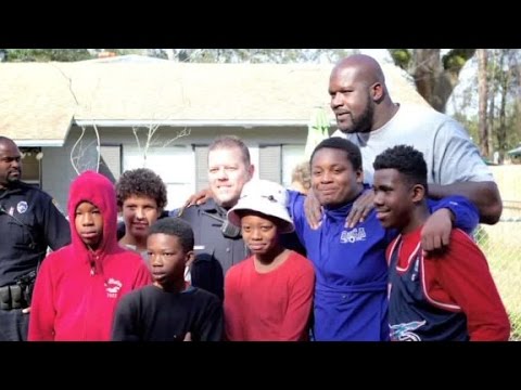 Shaquille O'Neil shoots hoops with neighborhood kids