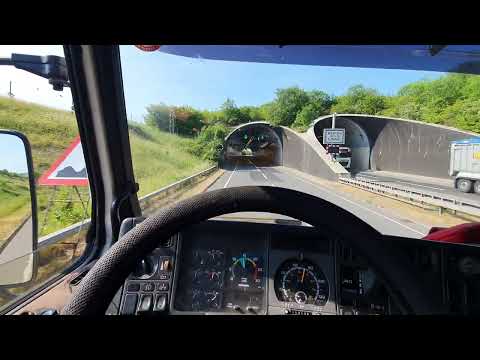 Scania 143 V8 hill climb through a tunnel.