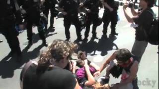 Denver Police Officer yells "Back it up Bitch" and clobbers a defensless young lady with g