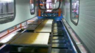 VIDALI IMPIANTI: Verniciatura automatica su impianto aereo a carosello.