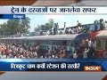 People travel on train rooftops to reach Amavasya Mela at Chitrakoot