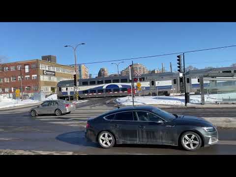 WINTER TRAINS Multilevel train crossing the intersection of Jean-Talon and Canora streets