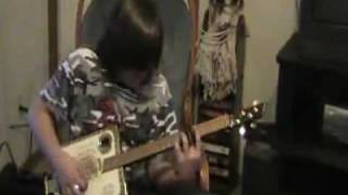 13 Yr Old Tony Busey Plays Cigar Box Guitar with Windshield Wiper Blades for Frets