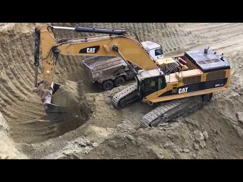 Caterpillar 385C Excavator Loading Trucks
