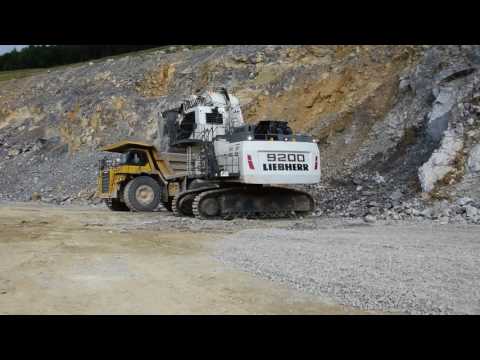 Liebherr R9200 front shovel loads Komatsu HD 785 dumptruck