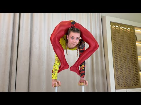 Bending in Bold: A Vivid Display of flexibility skill by Darina Toropova. Flexshow.
