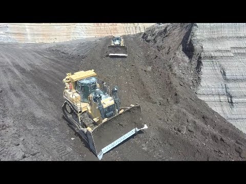 Two Caterpillar D9T Bulldozers Building A Ramp In Coal Mine